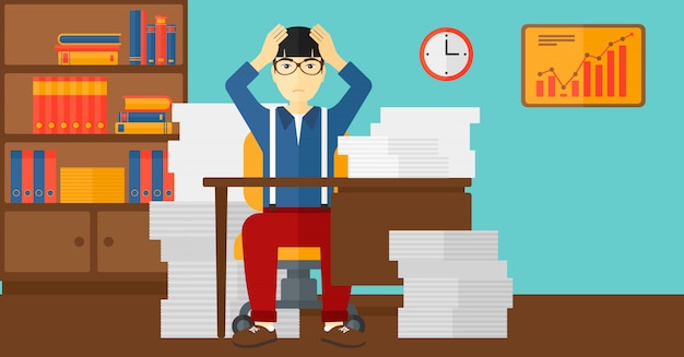 A worried-looking individual sitting at a desk covered in papers and folders pertaining to wills, trusts, and estate planning. The individual is rubbing their forehead with a pen in hand, seeming overwhelmed by the task at hand. The background is an office setting with bookshelves packed with legal books.