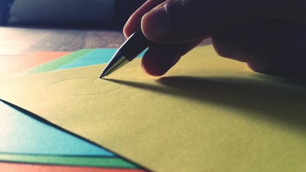 A close-up of a benefits statement highlighting key sections with different colorful markers. A pen is lying nearby, suggesting someone is actively reviewing the document.