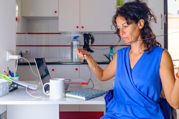 An employee using a company-provided standing desk with a monitor displaying a wellness app that tracks their activity levels and offers personalized health tips.