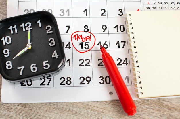 A calendar marked with vacation days, showing strategic planning of time off around company deadlines and slower periods.