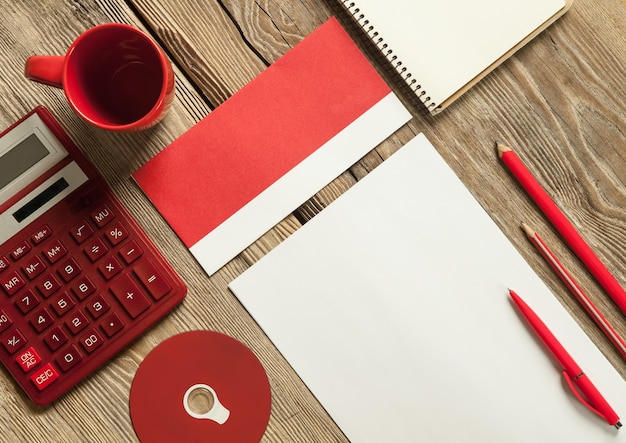 An image of a calendar with the tax deadline date circled in red. There are also various financial documents and a pen on the table.