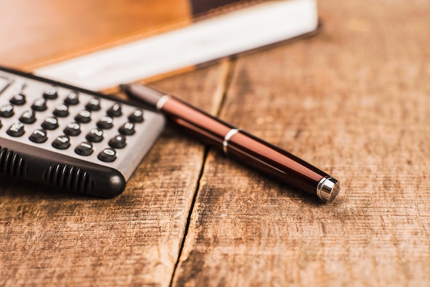 A close-up image of a tax form with a calculator and pen, highlighting the importance of accurate financial information when claiming education tax credits.