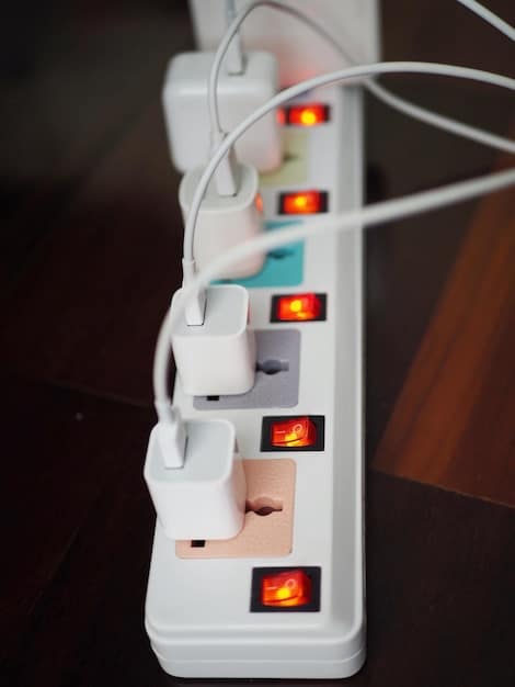A detailed view of a power strip with surge protection, highlighting the various outlets and the indicator light that shows it's protecting against surges.